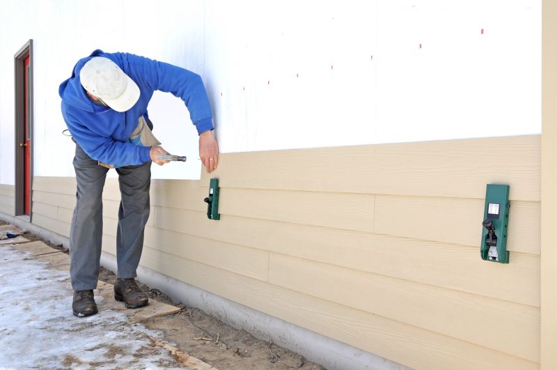 Vinyl siding being installed on a home